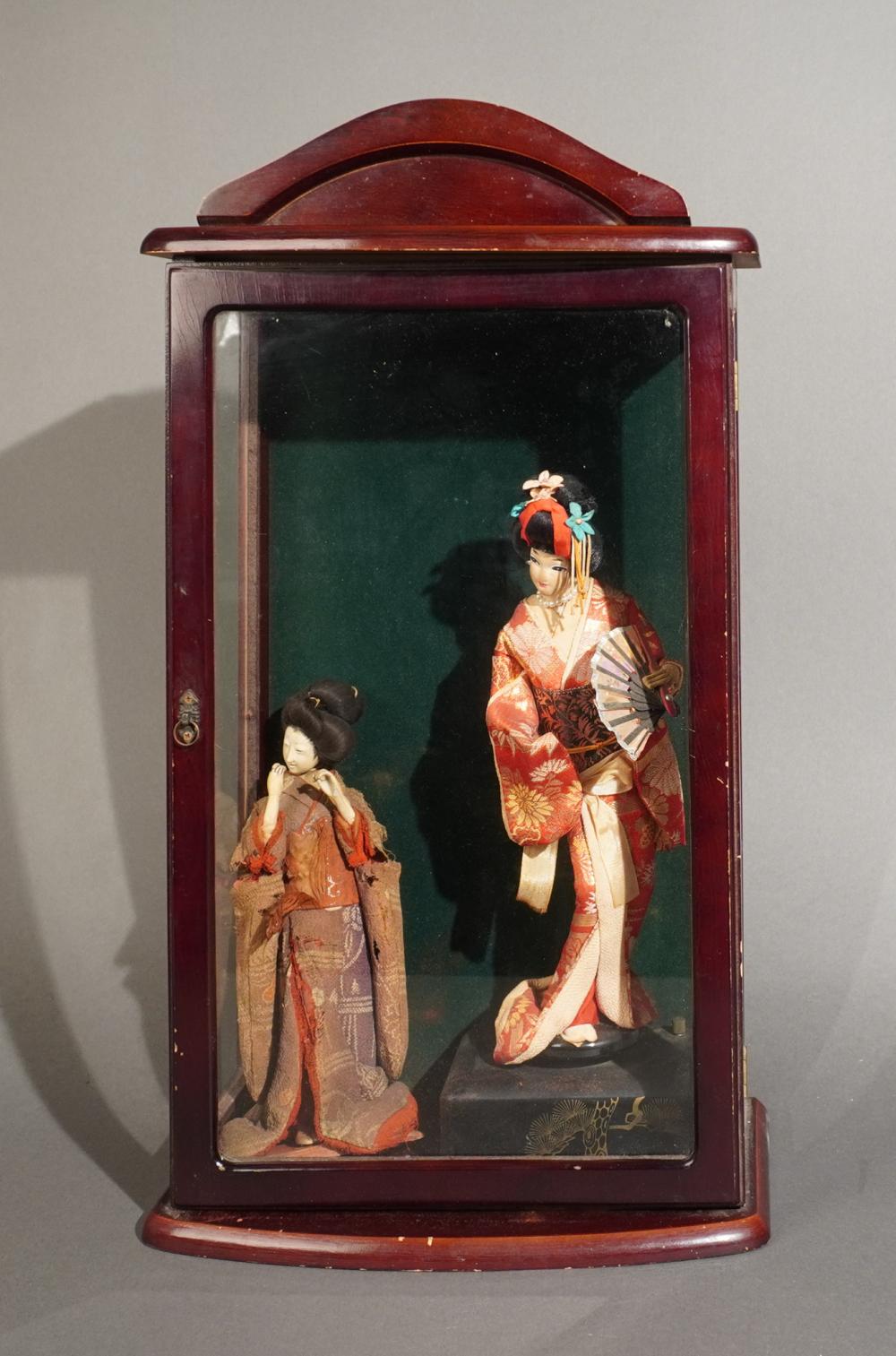 TWO JAPANESE DOLLS IN WOOD DISPLAY