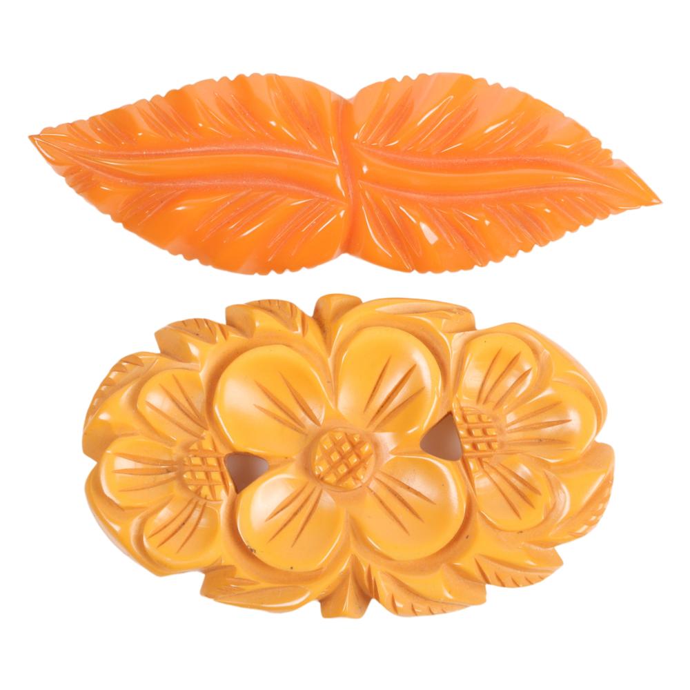 TWO BAKELITE PINS, LEAVES AND FLOWERS.