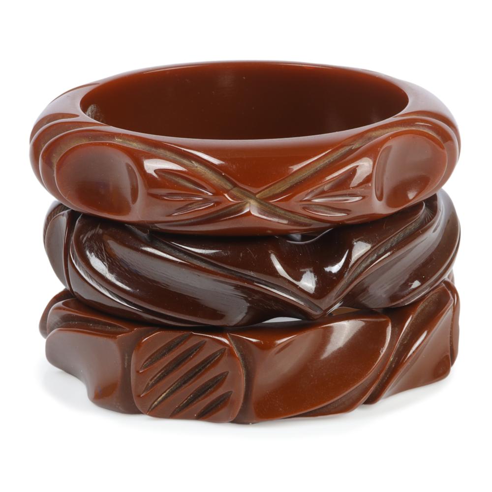 THREE DEEPLY CARVED BAKELITE BANGLE 30a542