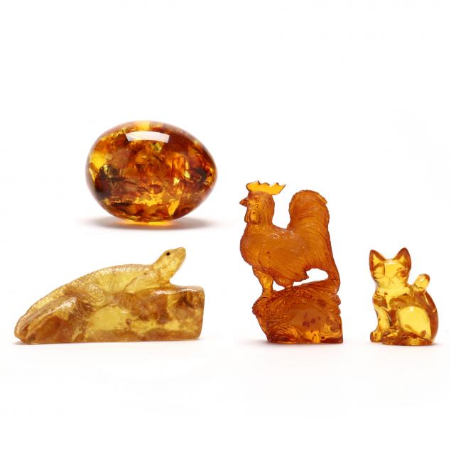 GROUP OF FOUR VINTAGE CARVED AMBER 30a6fe