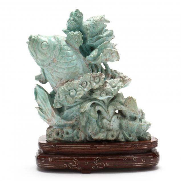 A CHINESE CARVED TURQUOISE FISH 30a701