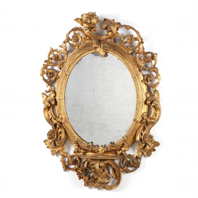 AN ITALIAN ROCOCO STYLE OVAL GILTWOOD