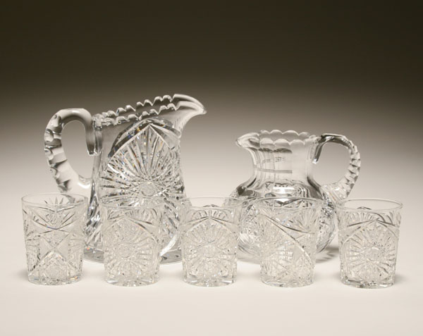 Seven cut glass pitchers and tumblers;