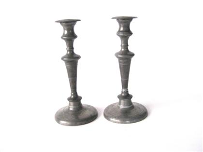 Two pair of  pewter candlesticks