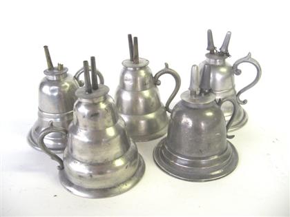 Five  pewter bell- form chamber