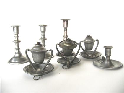 Group of pewter candlesticks and 4da67