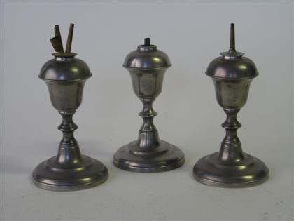 Three pewter urn-form lamps   