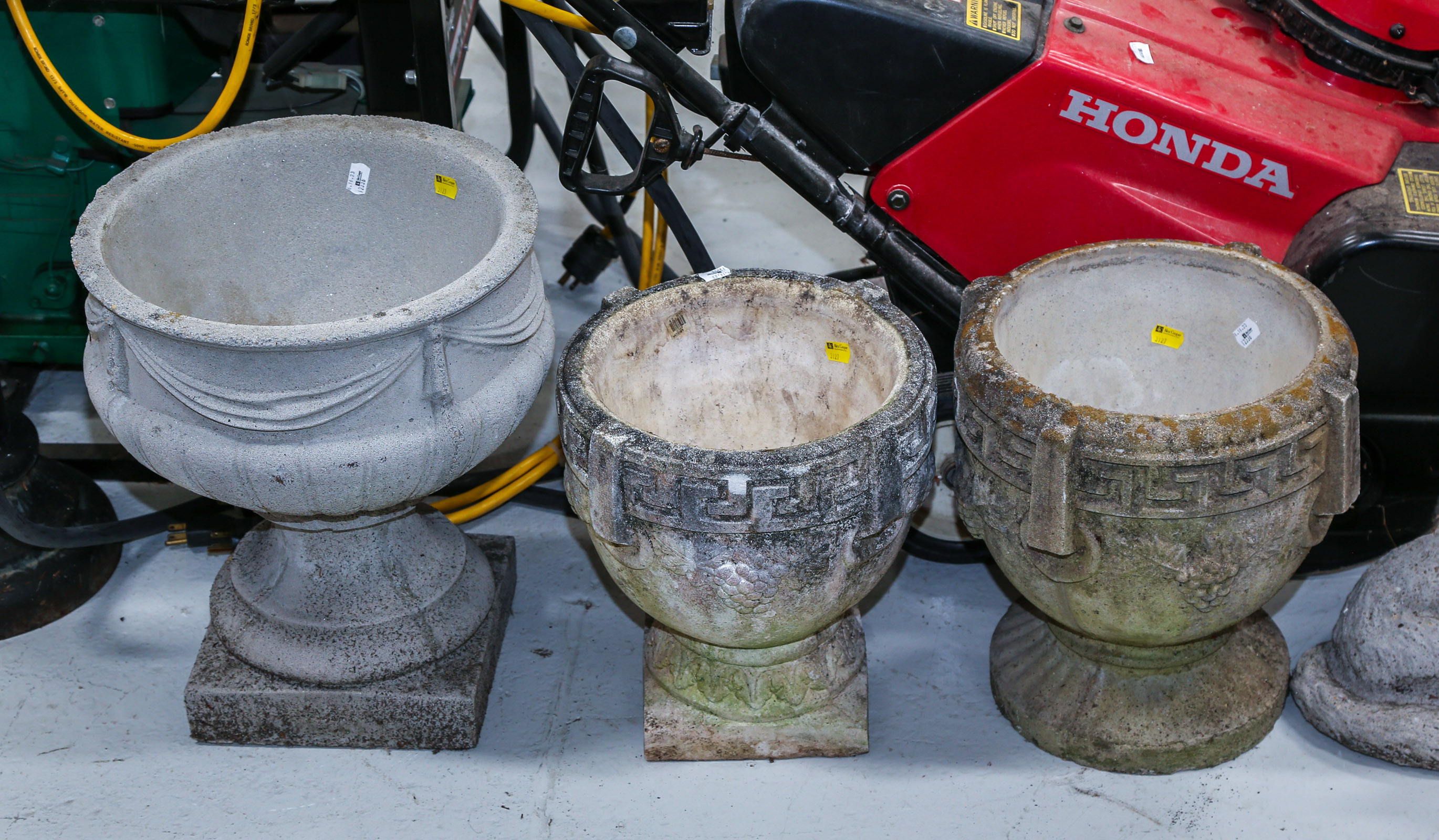 THREE CEMENT GARDEN URNS Late 20th