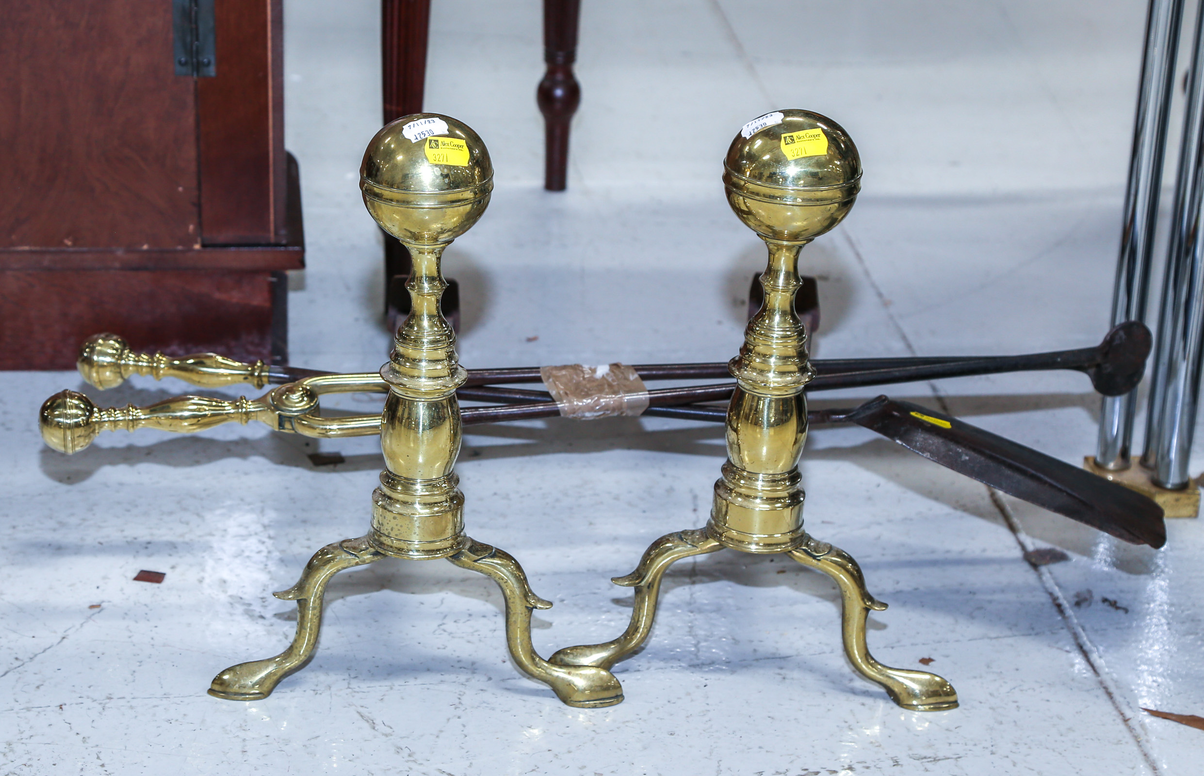 A PAIR OF ANDIRONS & FIRE TOOLS