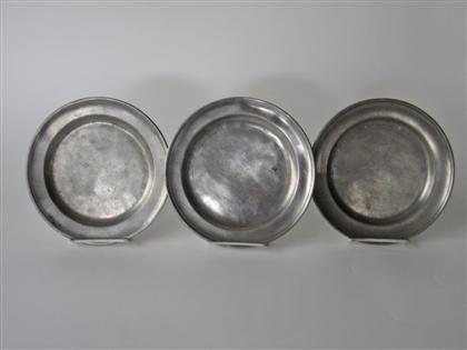 Three pewter plates with molded 4da91