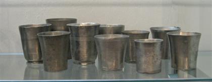 Ten pewter beakers    most american,