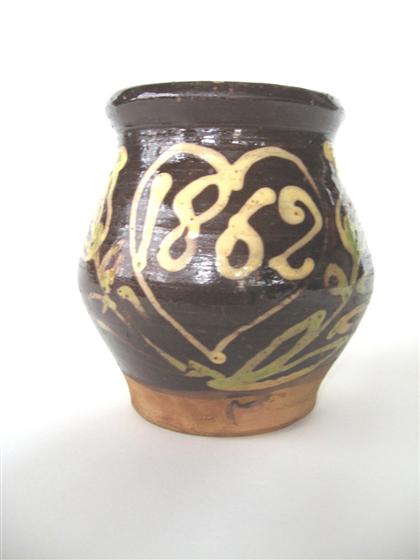 Slip-decorated and dated redware jug