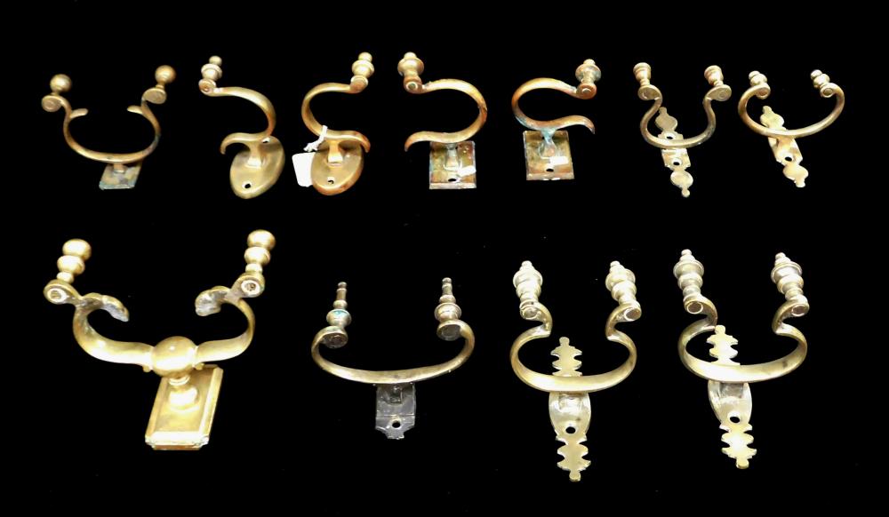 ELEVEN BRASS JAMB HOOKS, INCLUDING