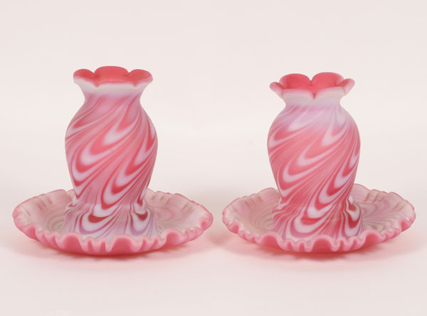 A pair of cranberry glass and opaque 4dfda