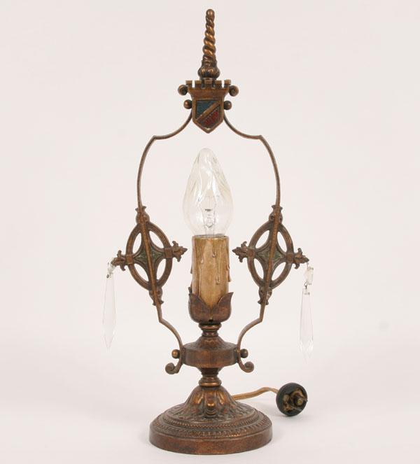 Cast metal lamp with twisted finial