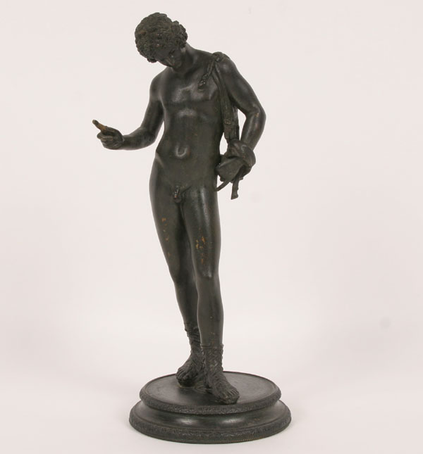 Cast metal statue of Narcissus with