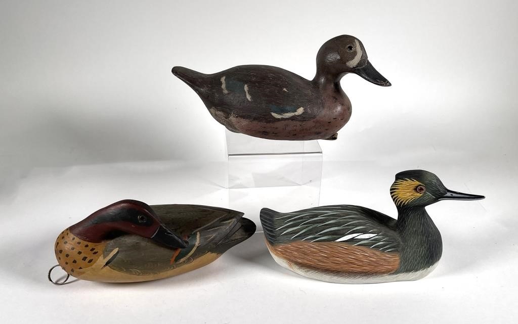  3 CARVED WOOD DUCK DECOYSThree 30c0c5