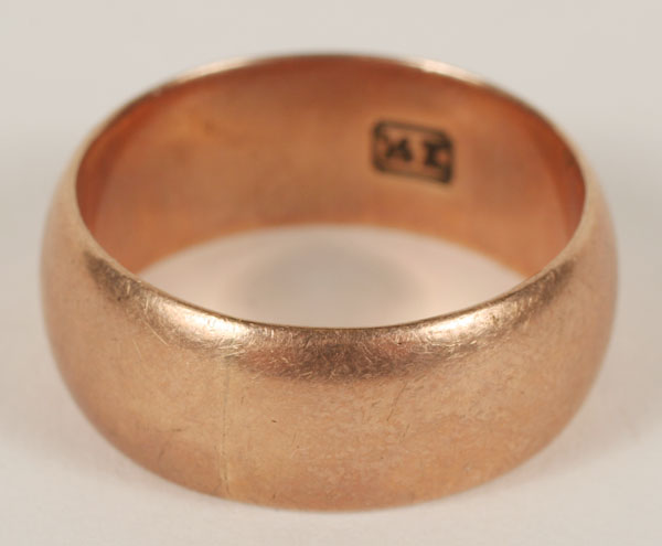 Men's 14K rose gold wedding band.