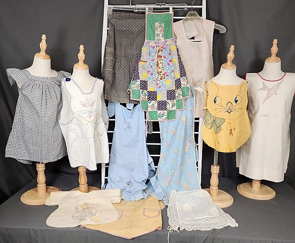 12 Antique Child Aprons and Pinafores.