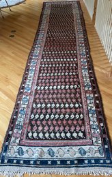Antique Oriental runner with repeating 30cb33