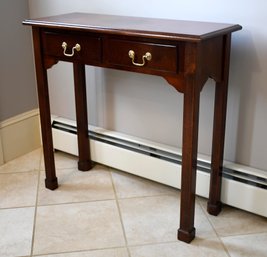 A contemporary wood hall table