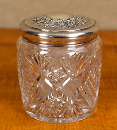 A vintage cut glass jar with Tiffany