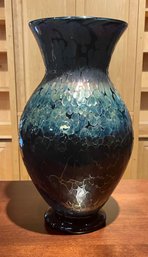 A large black metallic art glass