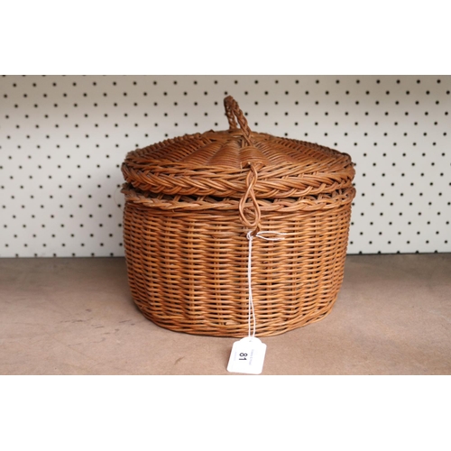 Vintage cane sewing basket full of sewing