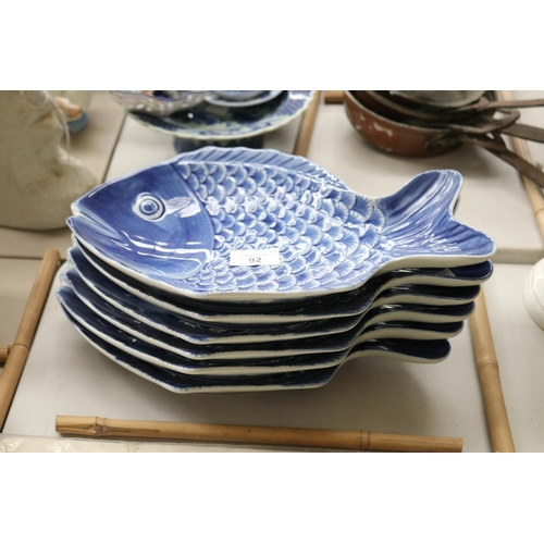 Set of six fish shaped plates, each