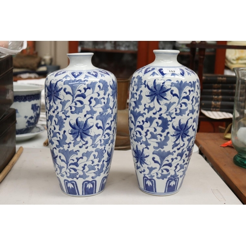 Pair of blue and white vases, each approx