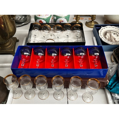 Assortment of boxed glass ware.