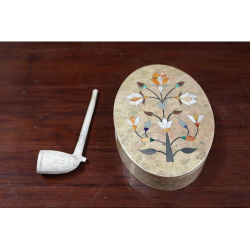 Oval stone inlaid box with a clay pipe,