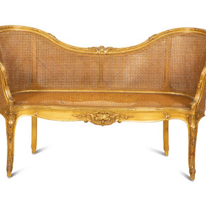 A Louis XV Style Caned Giltwood