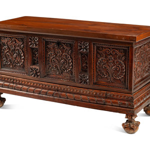 A Continental Carved Walnut Coffer
Incorporating