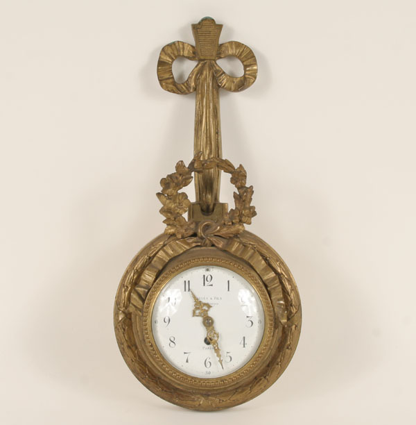 French gilt bronze cartel clock; Bagues