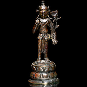 A Nepalese Parcel-Gilt Bronze Figure