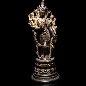 A Tibetan Parcel-Gilt Bronze Figure