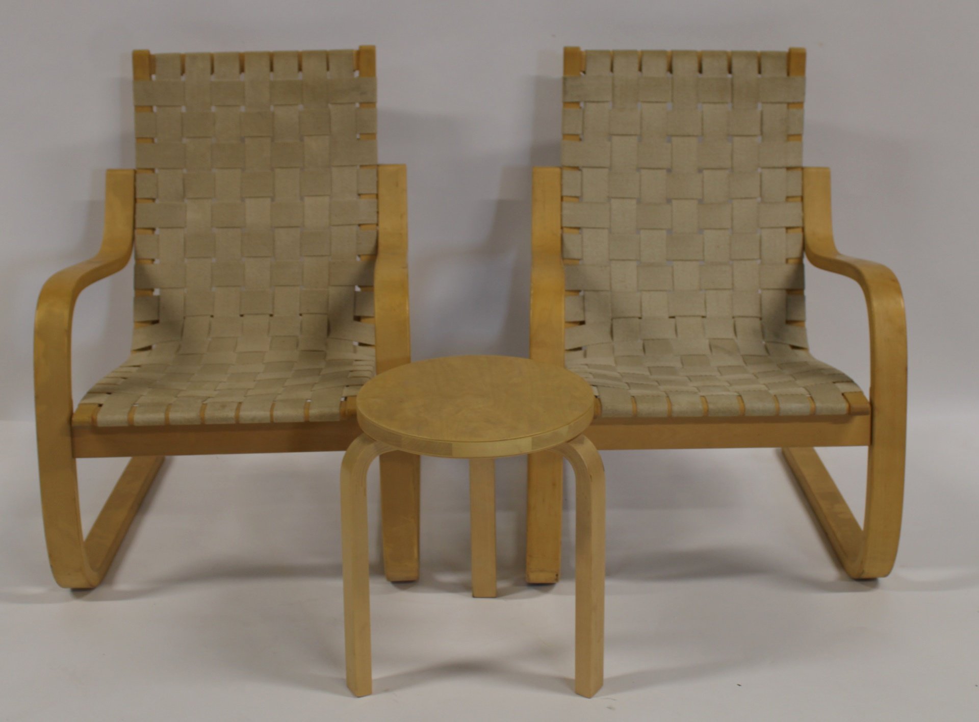 A PAIR OF ALVAR AALTO ARM CHAIRS TOGETHER