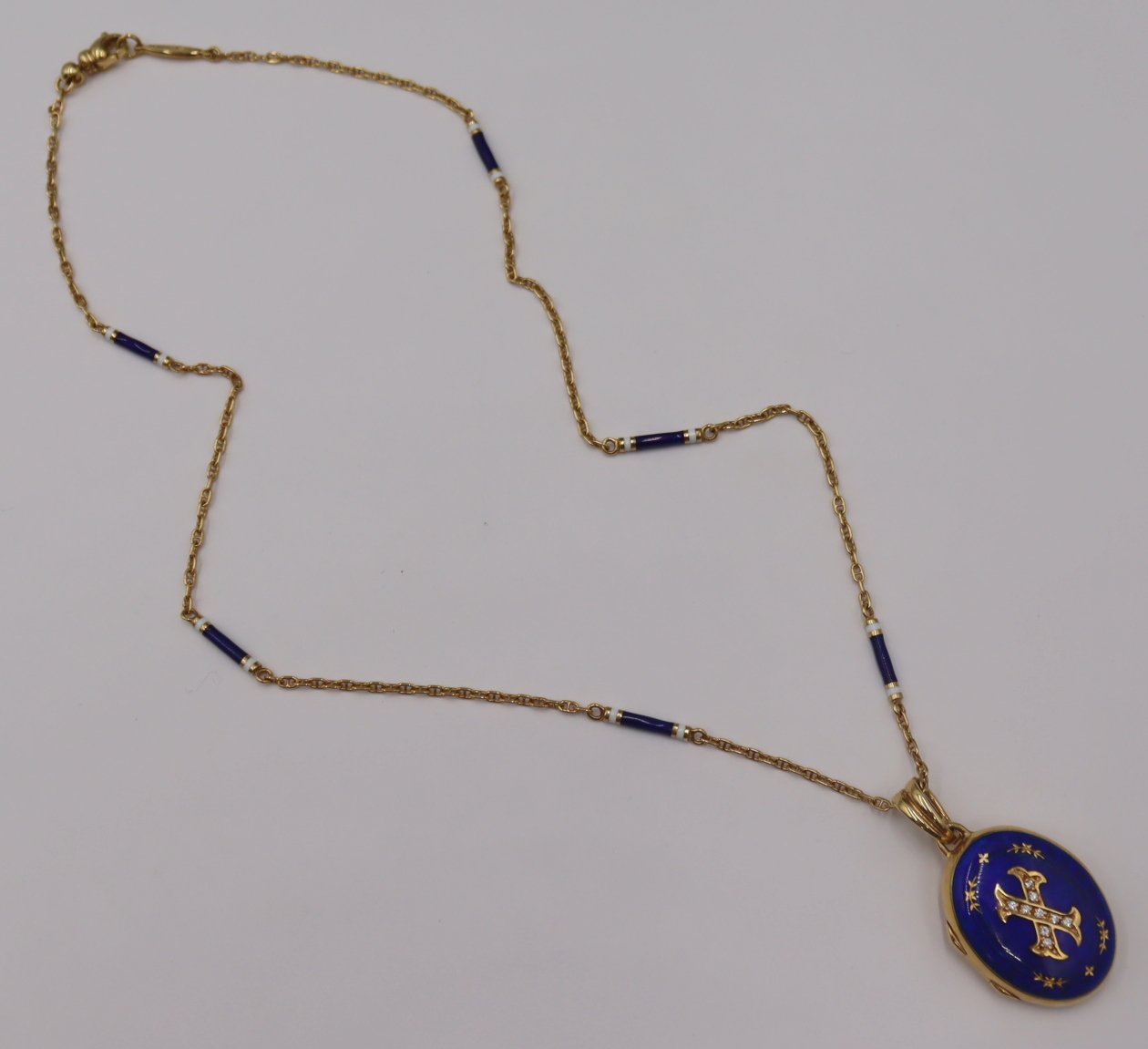 JEWELRY. FABERGE 18KT GOLD BLUE ENAMEL