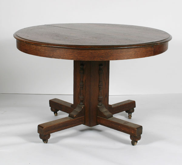 Round oak table with center pedestal;