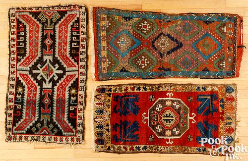 THREE ORIENTAL MATSThree Oriental mats.