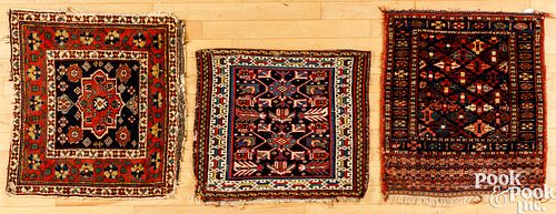 THREE ORIENTAL MATSThree Oriental mats.