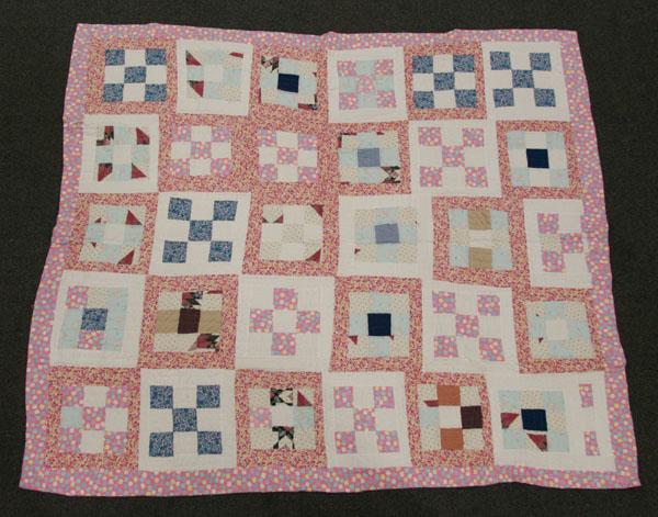 Cotton nine patch quilt; hand sewn body,