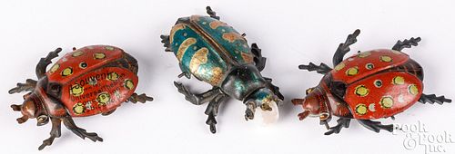 THREE TIN LITHOGRAPH BEETLE PENNY TOYSThree