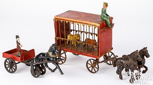 TWO CAST IRON HORSE DRAWN WAGONSTwo