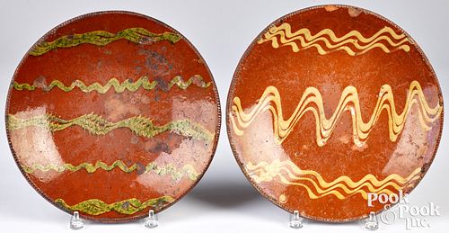 TWO SLIP DECORATED REDWARE CHARGERS  30ed92