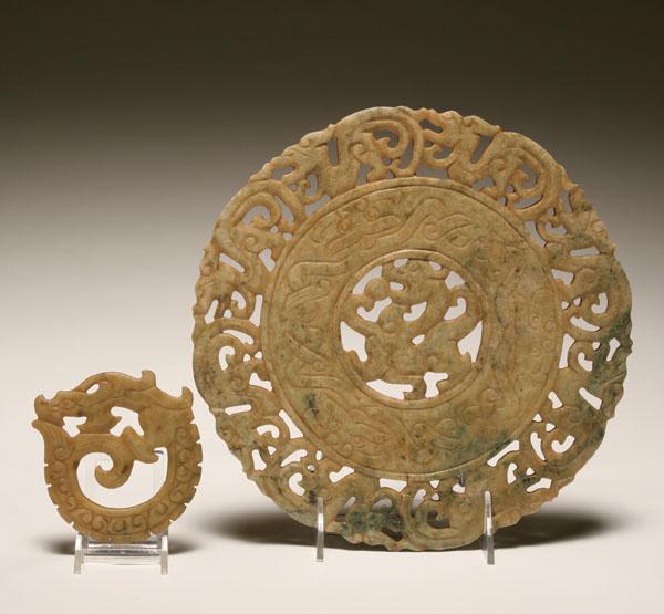Two soapstone carved discs; large disc