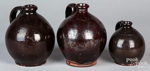 THREE PENNSYLVANIA REDWARE JUGS  30f128