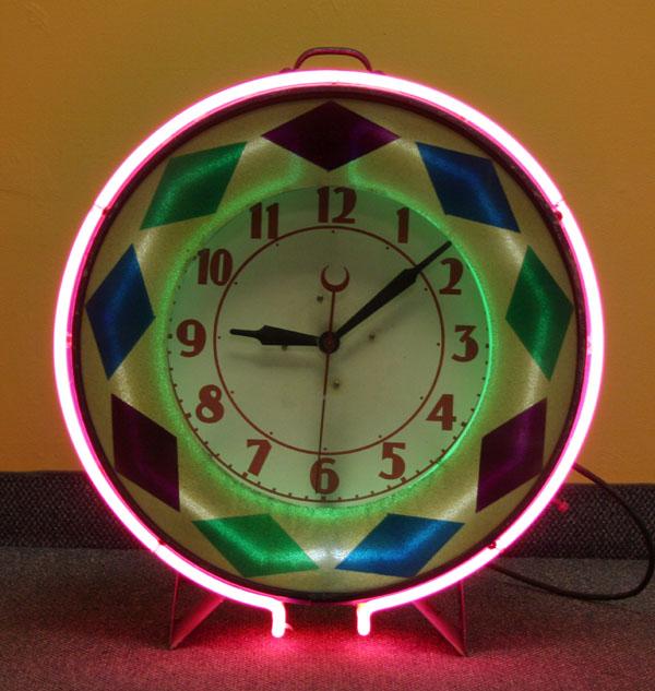 Machine Age neon circular clock;