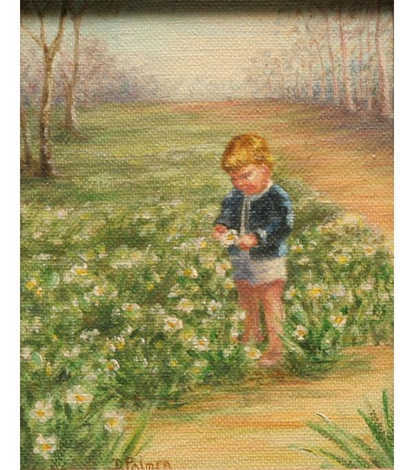 Boy in park meadow picking flowers;